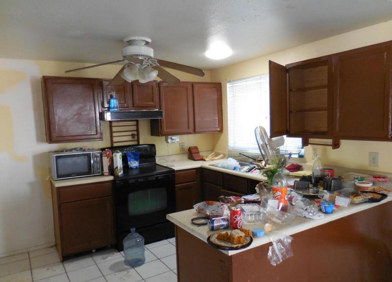 cluttered chaotic messy disorganized kitchen counters fixer-upper Mesa Arizona home house for sale photo