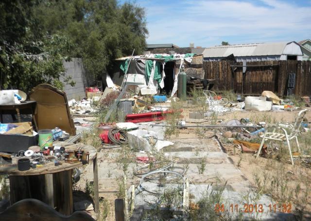 ugly back yard piles of junk garbage hoarding fixer-upper short sale Peoria Arizona home house real estate photo
