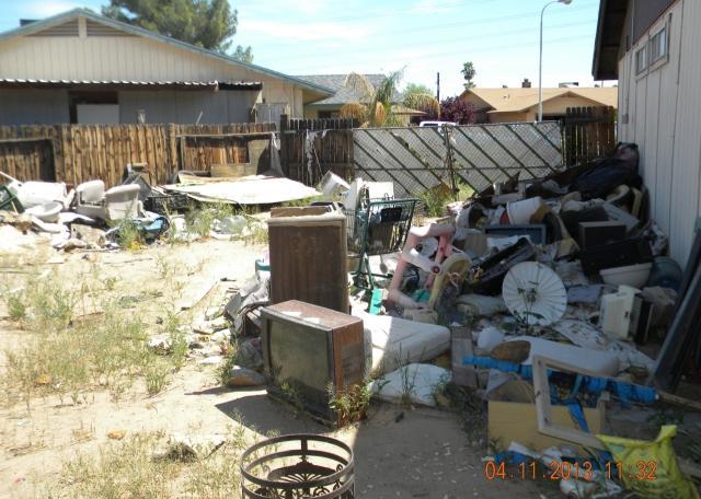 ugly back yard piles of junk garbage hoarding fixer-upper short sale Peoria Arizona home house real estate photo