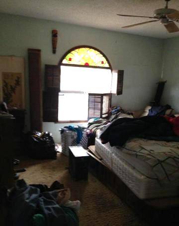 messy cluttered bedroom clothes everywhere bed unmade fixer-upper neglected Phoenix Arizona home house for sale