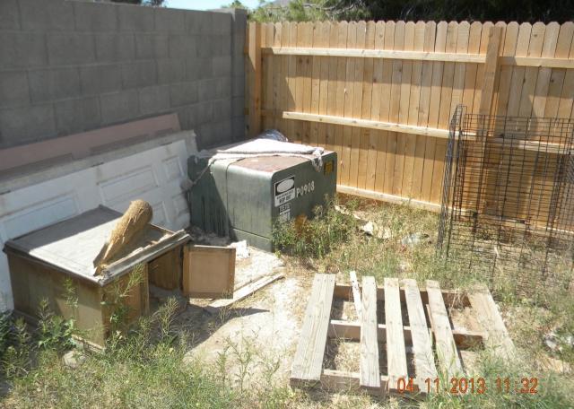 ugly back yard piles of junk garbage hoarding fixer-upper short sale Peoria Arizona home house real estate photo