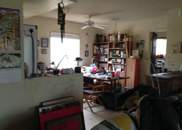 messy cluttered stuff junk everywhere dining room fixer-upper neglected Phoenix Arizona home house for sale photo