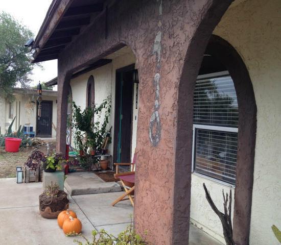 messy front yard door security camera curb appeal fixer-upper neglected Phoenix Arizona home house for sale photo