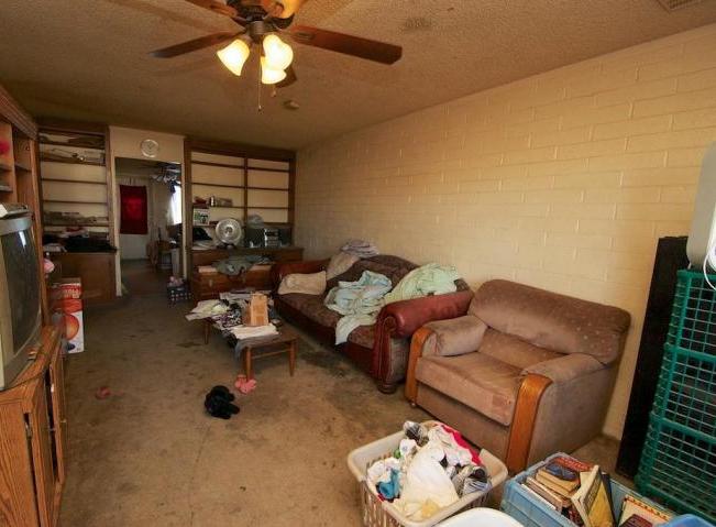 cluttered messy family room dirty soiled stained filthy disgusting carpet poor bad home staging Mesa Arizona house for sale