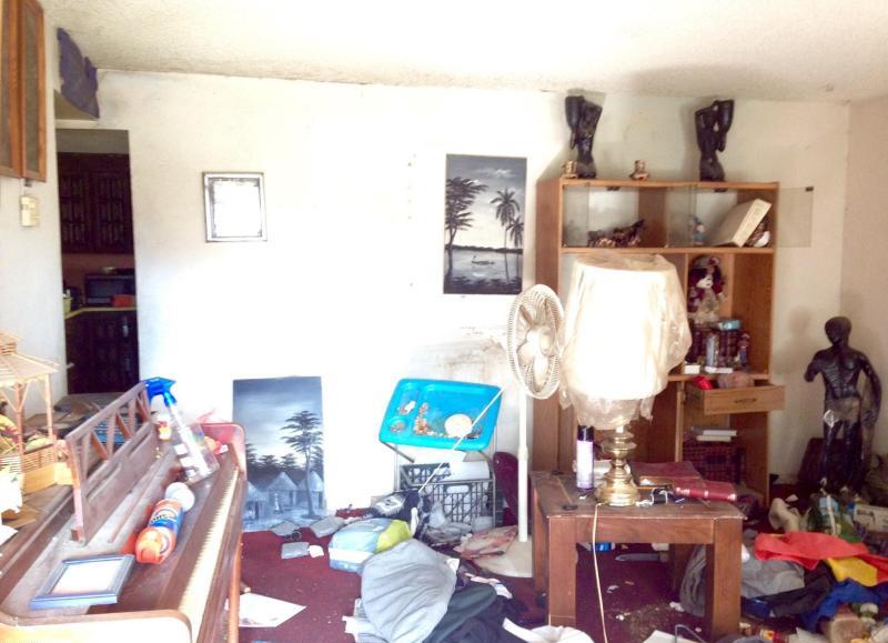 messy cluttered junky dusty dirty living room piano fixer-upper Phoenix Arizona homes houses for sale photo