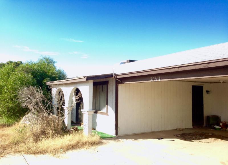 curb appeal front yard dead bush weeds neglected fixer-upper Phoenix Arizona homes houses for sale photo