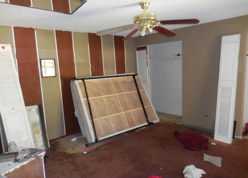 cluttered chaotic messy disorganized bedroom mirror on ceiling fixer-upper Mesa Arizona home house for sale photo