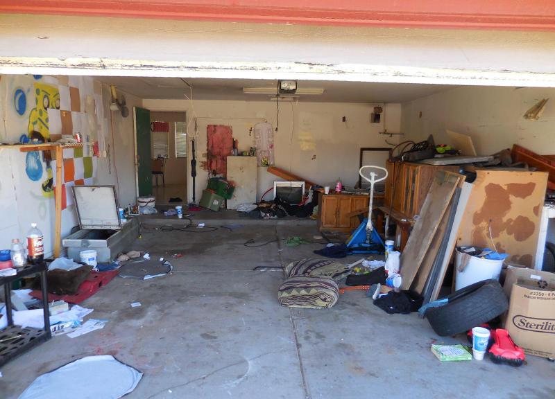 cluttered junky chaotic disorganized garage fixer-upper Mesa Arizona home house for sale photo