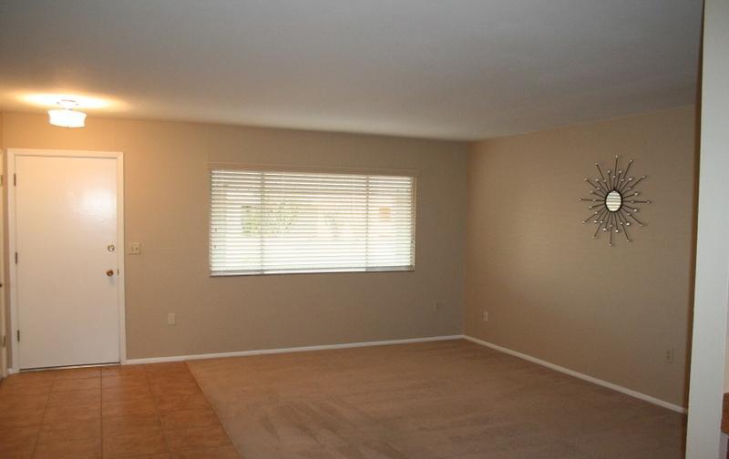 before after real estate photos pictures home staging clutter to clean living room Sun City Arizona house for sale