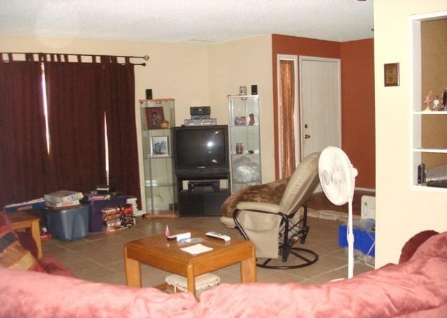 cluttered disorganized living room poor bad home staging Phoenix Arizona house for sale