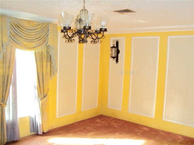outdated ugly décor carpet dining room yellow paint walls Dade City Florida home house for sale photo