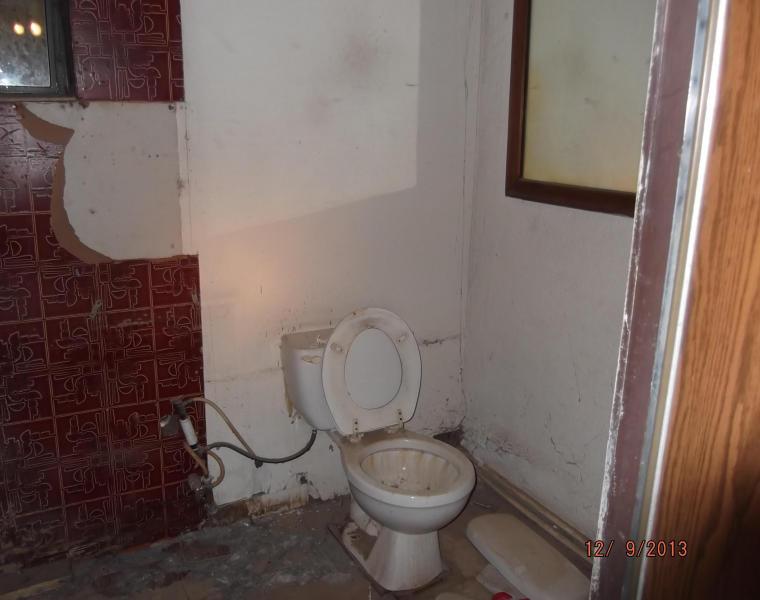 dusty dirty neglected dilapidated bathroom Eloy Arizona home house for sale real estate photo