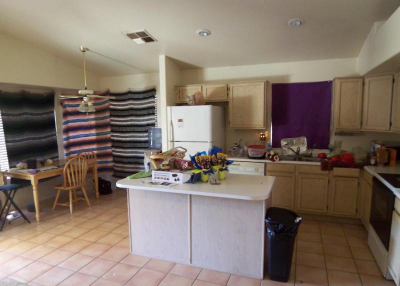 three blankets hung used as window curtains drapes cluttered kitchen short sale Gilbert Arizona home house photo