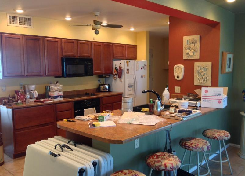 before after real estate photos pictures home staging clutter to clean kitchen Sun City Arizona house for sale
