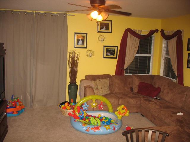 cluttered living room poor home staging kid's toys Queen Creek Arizona home house