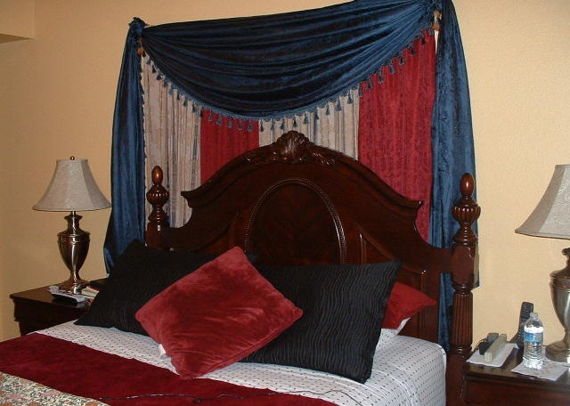 ugly tacky gaudy red white blue shiny satin drapery around bed Phoenix Arizona home