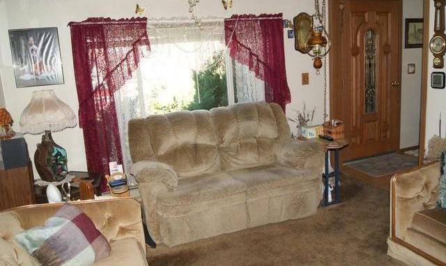 ugly tacky outdated décor white red blood wine color lace window curtains drapes Fort Morgan Colorado home house for sale photo