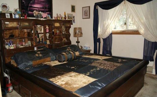 bedroom cluttered too many items visual distractions poor bad staging waterbed Fort Morgan Colorado home house for sale photo
