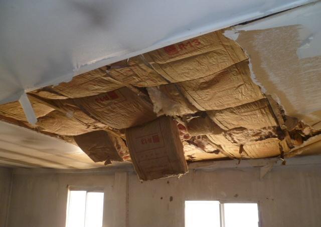 damaged big hole in ceiling exposed rafters attic fixer-upper Phoenix Arizona homes houses for sale real estate photo