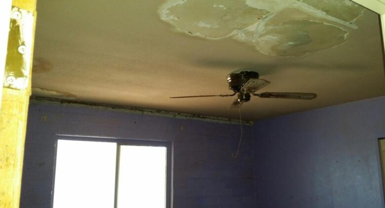 damaged ceiling dirty dusty old ceiling fan fixer-upper Gilbert Arizona homes houses for sale real estate photo