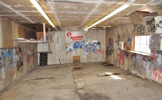 graffiti unfinished ceiling garage fixer-upper Omaha Nebraska home house for sale real estate photo
