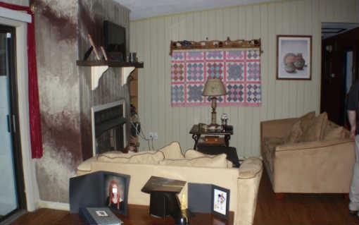 ugly faux paint treatment outdated red white gray stripes fireplace surround Lake City Florida home house for sale photo
