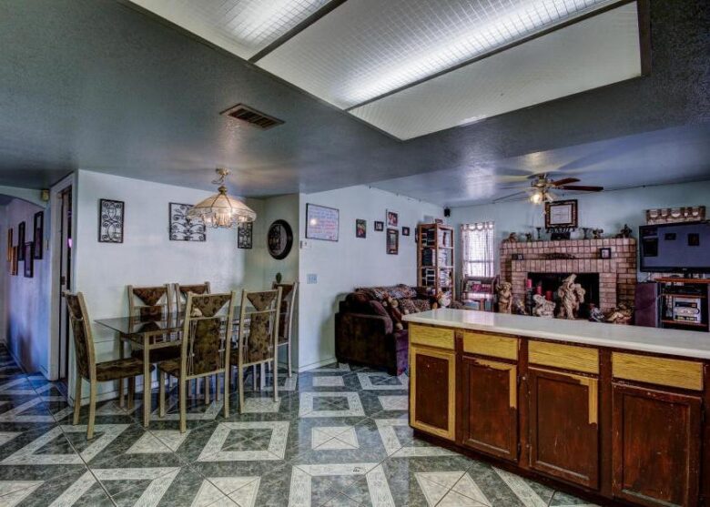 ugly floor tile pattern kitchen cabinets peeling paint lacquer finish missing Phoenix Arizona house for sale