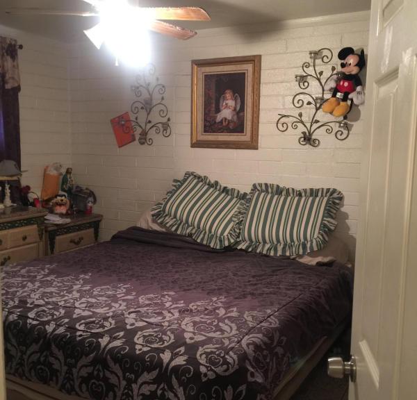 Mickey Mouse doll on bedroom wall Phoenix Arizona home house for sale real estate photo