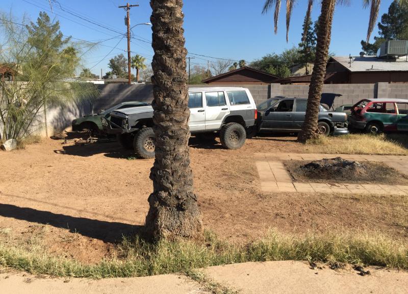 beat-up junker cars vehicles in back yard Phoenix Arizona home house for sale real estate photo