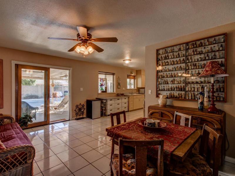 liquor bottle collection on display Phoenix Arizona home house for sale real estate photo