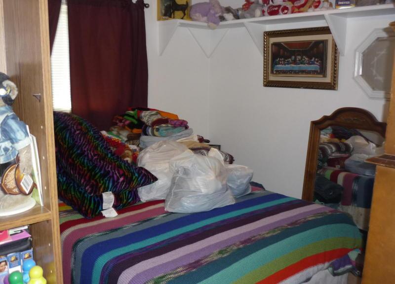 cluttered bedroom Afghan blanket poor home staging Glendale Arizona house for sale real estate photo