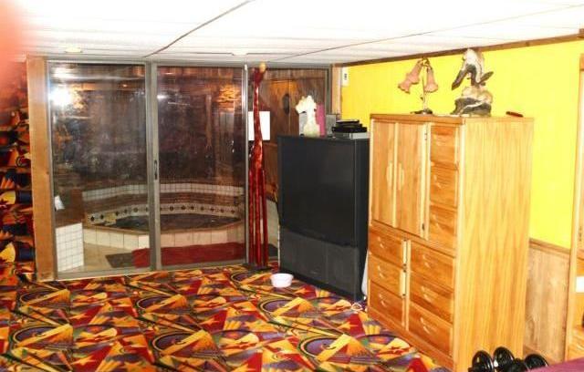 hot tub bedroom ugly tacky gaudy Las Vegas type colorful carpet Florissant Missouri home house for sale real estate photo
