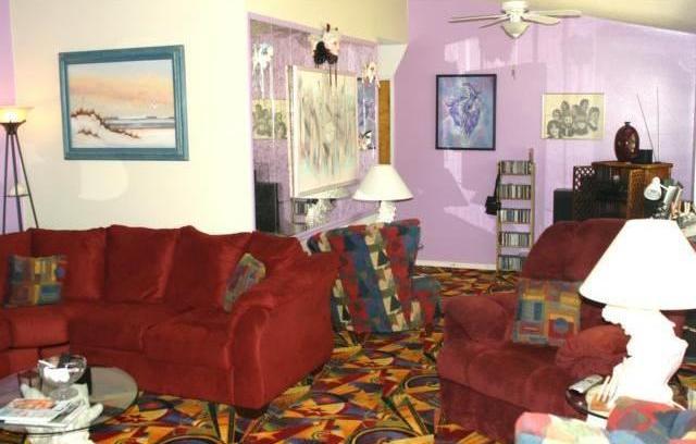 living room ugly tacky gaudy Las Vegas type colorful carpet chairs Florissant Missouri home house for sale real estate photo