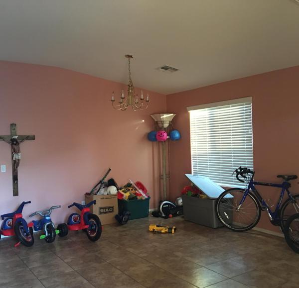 crucifix tricycles bicycle plastic Halloween pumpkin staging Laveen Arizona home house for sale real estate photo