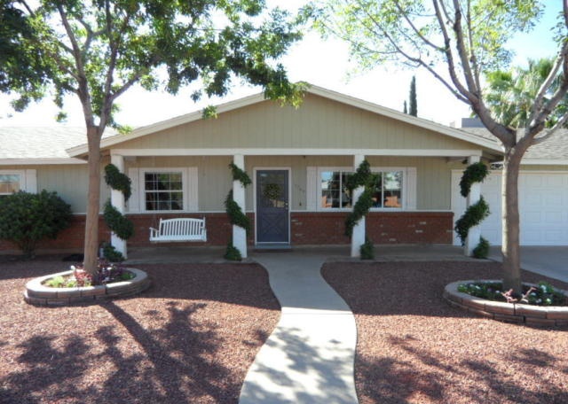 dumb idea wrapping fake plastic vines around front porch columns Mesa Arizona home house