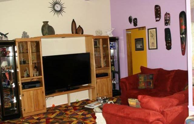 living room ugly tacky gaudy Las Vegas type colorful carpet Florissant Missouri home house for sale real estate photo
