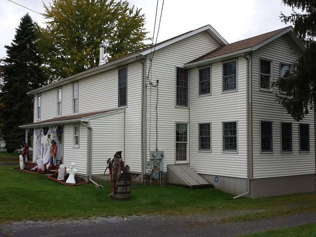 Halloween pumpkin decorations in front Penfield New York home house for sale real estate photo