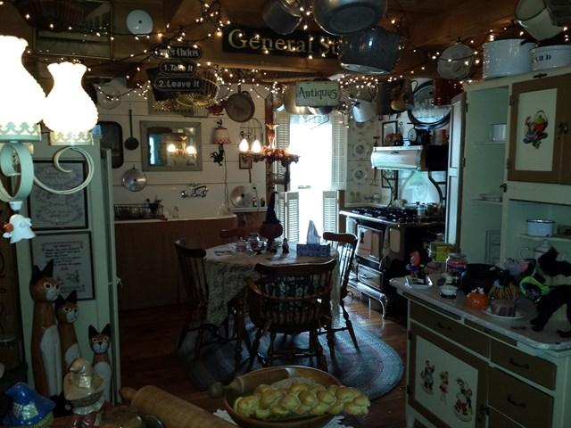 cluttered busy kitchen antiques black cat staging nightmare Penfield New York home house for sale real estate photo
